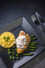 Green asparagus with grilled chicken fillet and couscous