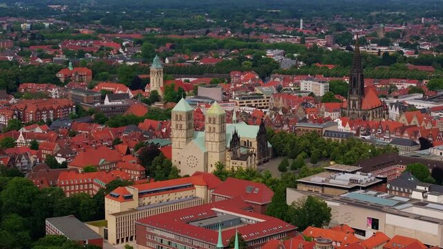 Munster, germany, features a captivating mix of historic churches including St. Paulus Dom and traditional homes, crafting a charming urban landscape rich in cultural heritage and significance