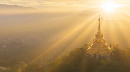 Fototapeta premium Enchanting Sunrise Over Thailand: Golden Rays Illuminating Hilltop Temple Serenity