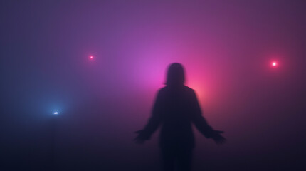Mysterious blurred silhouette of a man against a background of fog with multi-colored neon lights