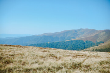 Mountain, sunny landscape. In the background there are mountains in perspective.