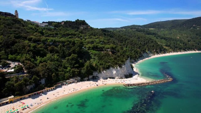 Italy summer holidays, best scenic sea landscape and beaches of Riviera del Conero- natural park near Ancona. Marche. View of picturesque beach Spiaggia del Frate. 4k hd aerial drone video