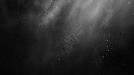 A stunning black and white abstract image showcasing scattered particles and mist, creating a celestial atmosphere.