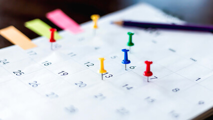 Embroidered pins on a calendar appointment appointment