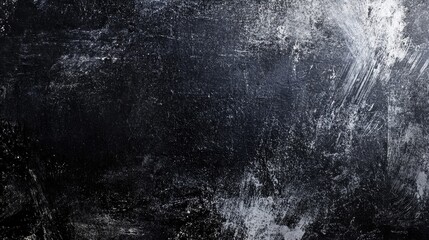 Fototapeta premium A textured, dark background showcasing a mix of black and white tones for a dramatic effect.