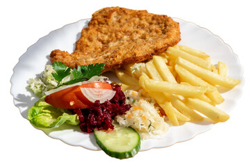 pork chop, fries and salad on a white plate