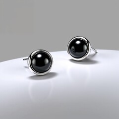 Sterling silver stud earrings with onyx stones bold and striking on plain white background