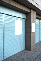 Fototapeta premium white poster mockup on blue wall in the street