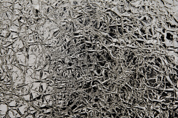 Dark silver foil texture background. Wrinkled foil paper textured