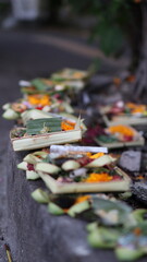 Canang Sari daily Offerings made by Balinese Hindus on the Ground of the streets of Bali