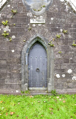 old wooden door in a  stone church
