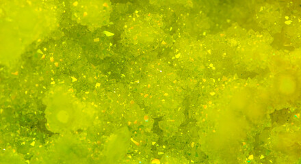 Green crystal mineral stone. Gems. Mineral crystals in the natural environment. Texture of precious...