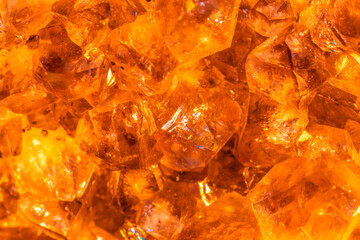 Golden crystal mineral stone. Gems. Mineral crystals in the natural environment. Texture of precious and semiprecious stones. Seamless background with copy space.