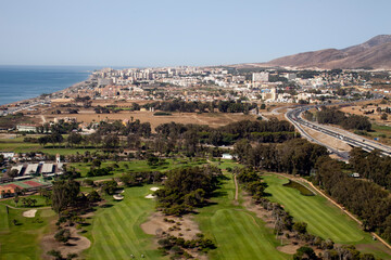 Fototapeta premium Aerial View of Malaga\'s Coastline and Urban Landscape on a Clear Day