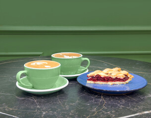cappuccino and cake on the table in the restaurant
