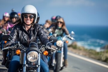 Group of female bikers on a coastal road celebrating International Female Ride Day