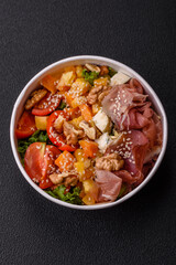 Appetizing salad with prosciutto, pumpkin, cheese and tomatoes