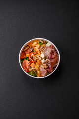 Appetizing salad with prosciutto, pumpkin, cheese and tomatoes