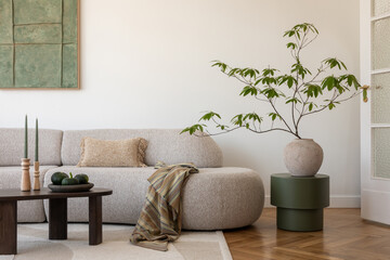 Stylish modern living room. A spacious sofa and minimalist decor in earthy tones create a warm and inviting living area, perfect for relaxation.