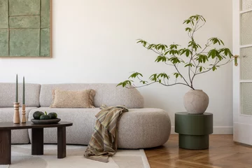 Fotobehang Hotel chique Stylish modern living room. A spacious sofa and minimalist decor in earthy tones create a warm and inviting living area, perfect for relaxation.  © FollowTheFlow