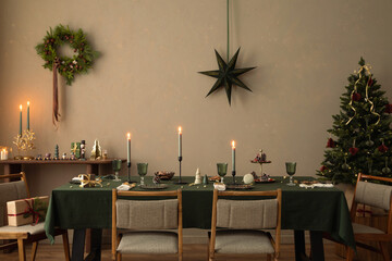 Interior design of warm dinning room interior with christmas table, wooden console, christmas gifts, gingerbread, candle, star on wall christmas wreath and personal accessories. Home decor. Template.