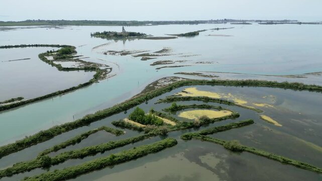 Grado Lagoon seen from above. Between waters, islands and uncontaminated nature
