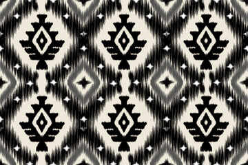 A bold, geometric, ikat pattern in black and white, perfect for textiles or home decor.