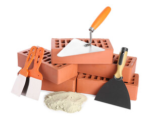 Trowel, putty knives, cement powder and red bricks isolated on white. Building materials and...