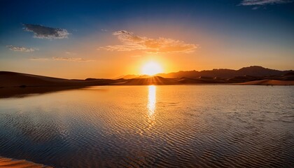 Obraz premium Sunset over a desert lake
