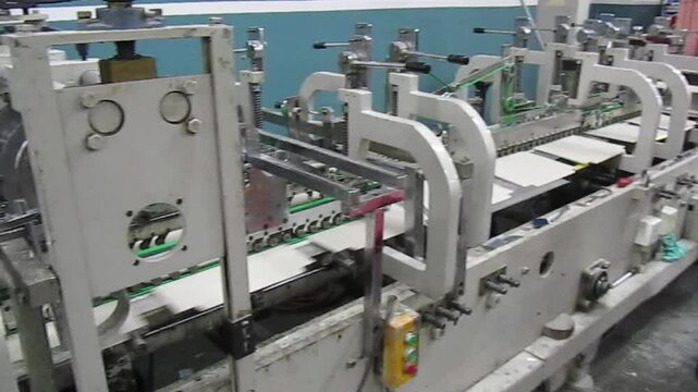 machine that folds printed boxes in a printing house