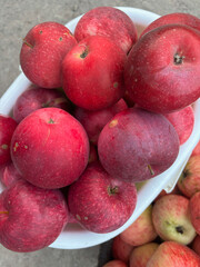 Bright red ripe apples in a basket. Close-up. Shot from above.