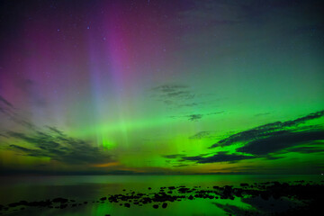 Northern light dancing above the Baltic Sea in Sweden
