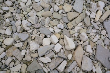 Closeup of rounded rocks and pebbles on the shores of Georgian Bay off Lake Huron, in the Great Lakes.