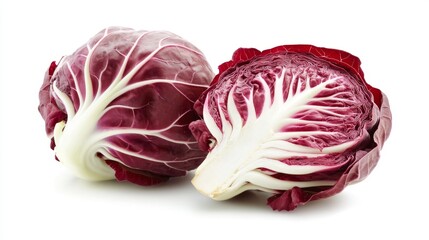 Fototapeta premium Two fresh radicchio heads one cut in half with vibrant red leaves and white veins isolated on a clean white background perfect for food-related design and culinary concepts.. Generative AI
