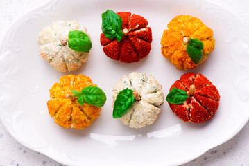 Pumpkin-Shaped Cheese Balls with Spices.selective focus