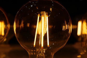 Light bulbs with big yellow filaments inside in vintage style