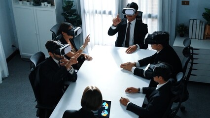 Top view of project manager working on laptop and sending data analysis to business people by using VR glass headset. Professional marketing team enter metadata or virtual world program. Directorate.