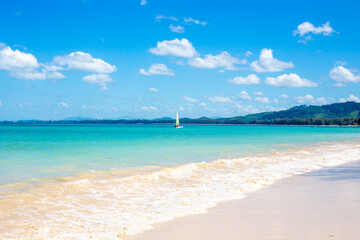 Beautiful seascape. Blue sky and sailboat in the sea. Idyllic seaside vacation