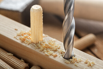 hole in wooden oak board for wooden dowel. carpentry industry.