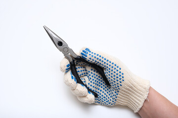 A person is holding a pair of blue and white gloves and a pair of pliers. The gloves are blue and white with black dots. Concept of caution and safety