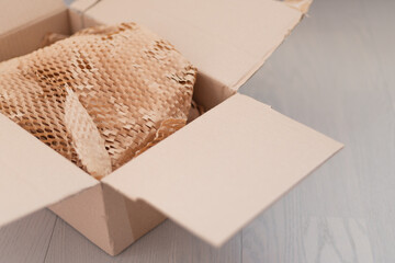 Corrugated paper for safe transportation, courier delivery service are packed, ecological packaging...