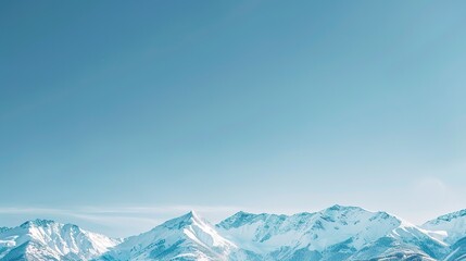 Snow-capped mountains against a clear blue sky as a retirement background
