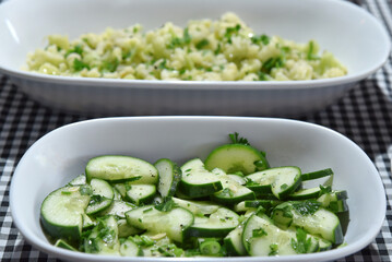 healthy food dish with salad greens vegetables seasoned salad vegan lunch tomato and onion green zucchini