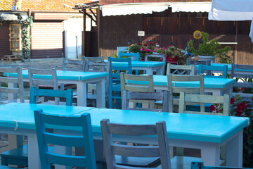 Interior of a cafe in a resort town. Tables and chairs in a cafe.