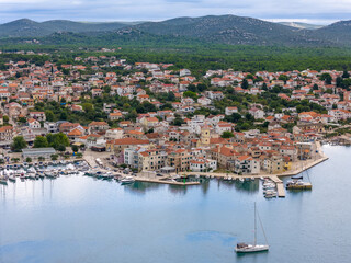 Fototapeta premium Aerial drone photo of the town of Pirovac at the adriatic coast in Croatia.