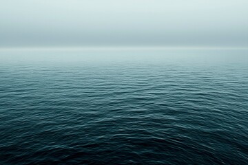 Obraz premium A Calm Sea with a Foggy Horizon