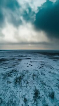 Winter camp of Yukaghir people in snowy tundra. Reindeer herding, teepees, and everyday traditions highlight resilience and cultural strength of Arctic nomadic culture. Vertical video