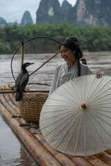 Happy Hanfu Woman smiles and thumbs up by Li River. China, 4K