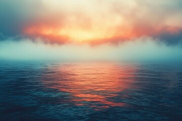Fototapeta premium Serene Ocean Surface with Misty Sunset Reflection