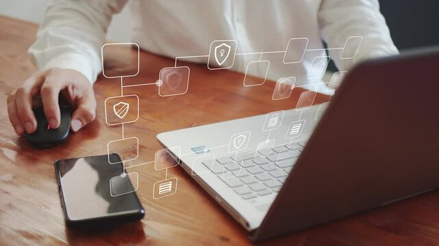 Animated model of a block diagram of the protection of databases and financial information against the background of a businessman working on a laptop. The concept of making money. Cg